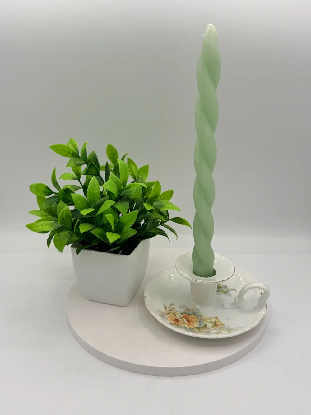 Vintage porcelain taper candle stick holder with floral motif and gold edging
